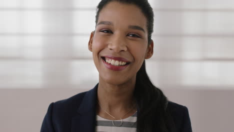 portrait-of-young-independent-mixed-race-business-woman-laughing-cheerful-looking-at-camera-ambitious-female-executive-close-up