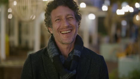 portrait-attractive-mature-man-laughing-enjoying-relaxed-urban-evening-in-city-wearing-warm-fashion-slow-motion