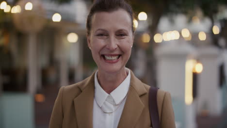 portrait-happy-middle-aged-business-woman-smiling-cheerful-enjoying-professional-urban-lifestyle-successful-caucasian-female-executive-wearing-stylish-fashion-in-city-evening