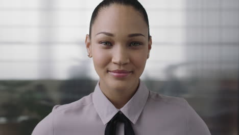 portrait-of-confident-young-mixed-race-business-woman-looking-serious-at-camera-wearing-stylish-fashion-in-office-workspace