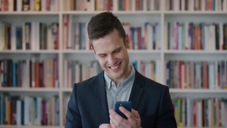 portrait-attractive-young-businessman-using-smartphone-enjoying-working-online-browsing-messages-smiling-happy-professional-male-on-mobile-phone-slow-motion