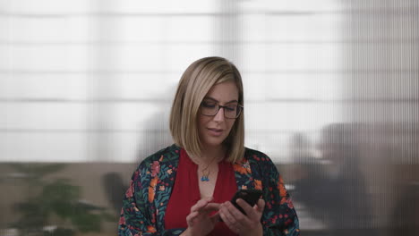 portrait-of-pretty-blonde-business-woman-texting-browsing-using-smartphone-serious-focused-female-networking-communicating-online-with-people