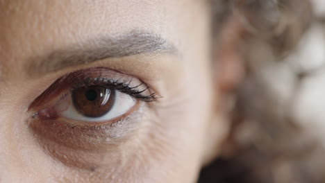 close-up-middle-aged-woman-eye-opening-looking-at-camera-female-wrinkles