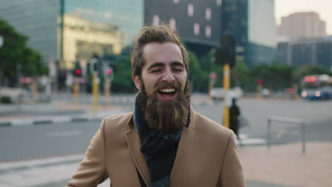 portrait-of-cute-young-hipster-man-laughing-cheerful-excited-dancing-on-urban-city-street-successful-winning