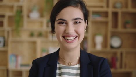 portrait-of-young-beautiful-woman-intern-laughing-cheerful-feeling-optimistic-in-workplace