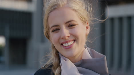 close-up-portrait-beautiful-young-blonde-woman-smiling-enjoying-happy-urban-lifestyle-sunny-day-in-city-cheerful-caucasian-female-enjoys-wind-blowing-hair