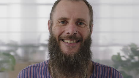 close-up-portrait-of-mature-hippie-entrepreneur-man-smiling-happy-looking-at-camera-confident-funky-businessman-with-beard