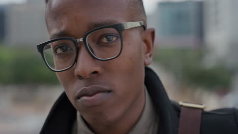 close-up-portrait-successful-african-american-man-student-looking-confident-wearing-glasses-independent-black-male-entrepreneur-slow-motion