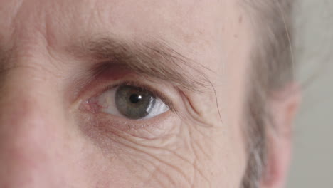 senior-man-eye-opening-looking-at-camera-beautiful-iris-macro-close-up