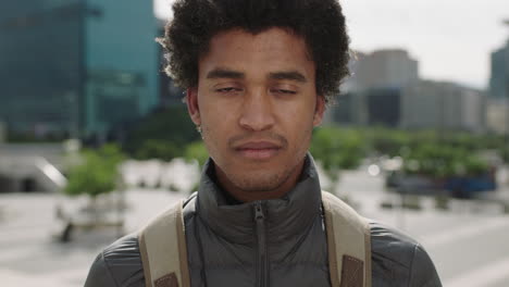 portrait-of-handsome-young-mixed-race-man-unhappy-worried-looking-at-camera-sad-in-urban-city-background
