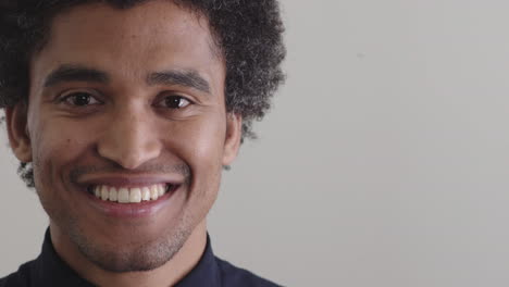 young-happy-mixed-race-man-smiling-enjoying-lifestyle-success-on-blank-background-copyspace-close-up