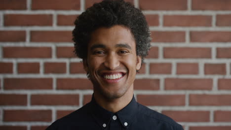 portrait-happy-young-mixed-race-man-smiling-cheerful-independent-male-enjoying-lifestyle-success-afro-hairstyle-slow-motion