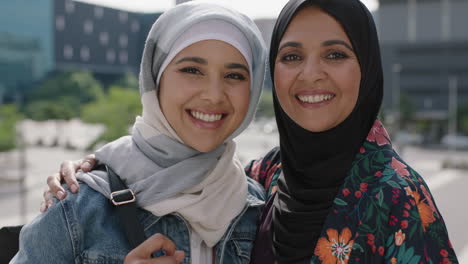 close-up-portrait-of-happy-mother-and-daughter-smiling-cheerful-embrace-in-urban-city-wearing-traditional-muslim-hajib-headscarf-enjoying-lifestyle
