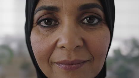close-up-portrait-of-senior-muslim-woman-looking-pensive-calm-at-camera-experienced-middle-aged-female-wearing-tradition-headscarf