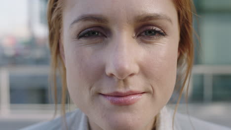 close-up-portrait-of-beautiful-red-head-business-woman-looking-up-at-camera-slow-motion-smiling-confident-real-people-series