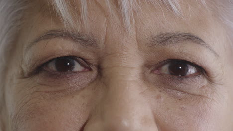 close-up-middle-aged-indian-woman-eyes-opening-looking-at-camera-blinking-pensive-staring-at-camera-healthy-eyesight