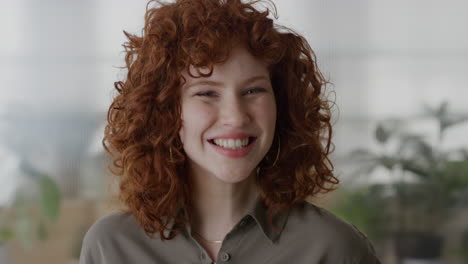 portrait-cute-red-head-business-woman-smiling-cheerful-enjoying-professional-career-young-stylish-female-in-office-slow-motion