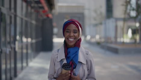 portrait-young-happy-african-american-woman-laughing-enjoying-happy-lifestyle-in-city-beautiful-black-muslim-businesswoman-looking-cheerful-wearing-hijab-headscarf-slow-motion
