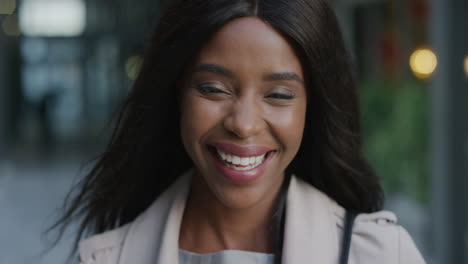 portrait-young-beautiful-african-american-woman-laughing-independent-businesswoman-enjoying-urban-lifestyle-wind-blowing-hair-black-feminine-beauty-slow-motion