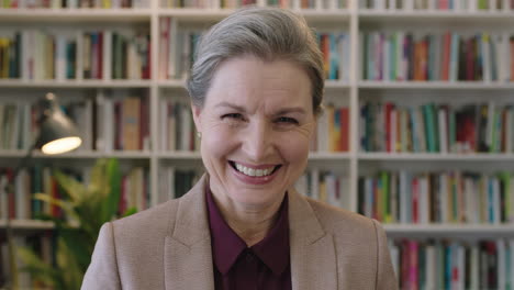 close-up-portrait-of-happy-senior-business-woman-executive-laughing-enjoying-successful-corporate-career-in-bookshelf-background