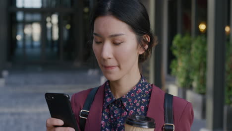 portrait-young-asian-business-woman-using-smartphone-browsing-online-messages-texting-on-mobile-phone-holding-coffee-in-outdoors-slow-motion-leisure-lifestyle
