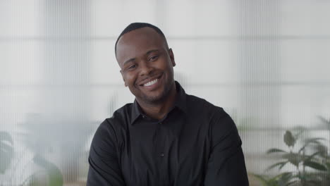 portrait-happy-young-african-american-entrepreneur-laughing-arms-crossed-enjoying-professional-lifestyle-success-black-businessman-in-office-slow-motion-career-ambition