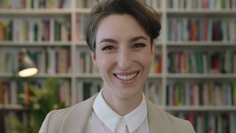 portrait-of-young-beautiful-caucasian-woman-smiling-happy-enjoying-career-opportunity-successful-female-looking-at-camera-in-library-bookshelf-background