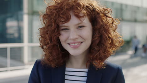 young-red-head-business-woman-portrait-smiling-happy-intern-campus
