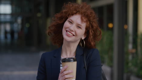 portrait-beautiful-young-happy-business-woman-smiling-enjoying-successful-lifestyle-holding-coffee-wind-blowing-hair-in-urban-outdoors-background-ambition-success