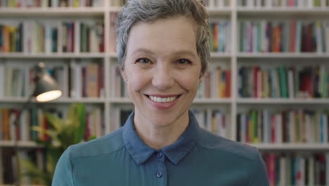 portrait-of-mature-lively-caucasian-woman-librarian-laughing-cheerful-enjoying-career-education-milestone-cheerful-middle-aged-female-in-library-background