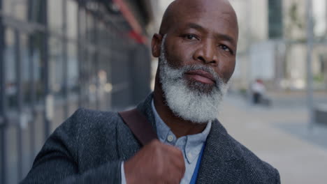 portrait-successful-senior-african-american-businessman-in-city-enjoying-professional-urban-lifestyle-mature-black-man-commuter-slow-motion