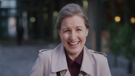 portrait-successful-middle-aged-caucasian-woman-laughing-excited-enjoying-successful-urban-lifestyle-cheerful-mature-female-in-city-having-fun-slow-motion
