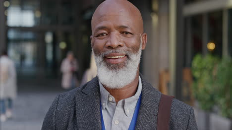 portrait-happy-mature-african-american-businessman-smiling-in-city-enjoying-professional-urban-lifestyle-cheerful-black-man-commuter-slow-motion