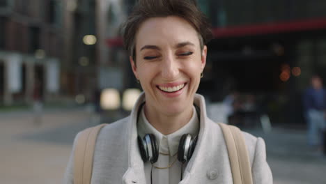 portrait-of-cheerful-young-business-woman-executive-laughing-happy-enjoying-corporate-career-in-city