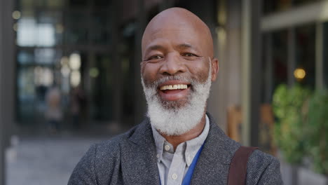 portrait-happy-mature-african-american-businessman-laughing-in-city-enjoying-professional-urban-lifestyle-cheerful-black-man-commuter-slow-motion