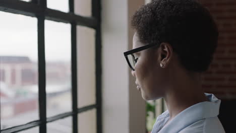 close-up-portrait-african-american-woman-drinking-coffee-at-home-black-entrepreneur-enjoying-relaxed-morning-looking-out-window-thinking-contemplative-wearing-glasses