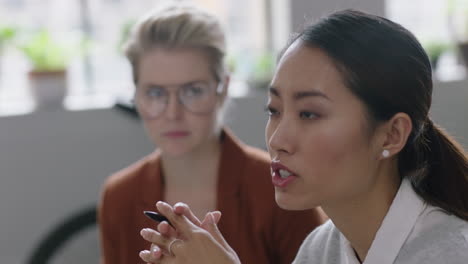 portrait-professional-asian-business-woman-discussing-creative-ideas-beautiful-female-office-manager-sharing-conversation-brainstorming-in-modern-startup-workplace-close-up