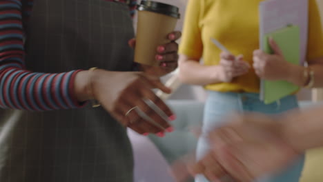 close-up-happy-business-people-meeting-african-american-woman-client-shaking-hands-professional-business-people-collaborating-planning-partnership-deal-in-startup-office