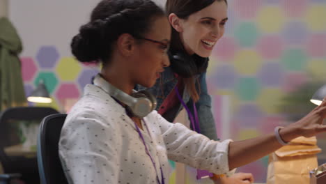 business-people-working-mixed-race-team-leader-woman-sharing-advice-pointing-at-screen-discussing-project-showing-support-using-computer-in-colorful-office