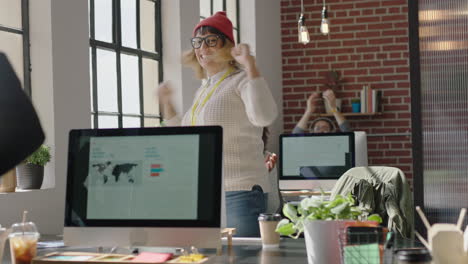 happy-caucasian-business-woman-celebrating-success-enjoying-victory-jumping-excited-colleagues-clapping-arms-raised-showing-support-cheerful-enthusiastic-teamwork-in-diverse-office