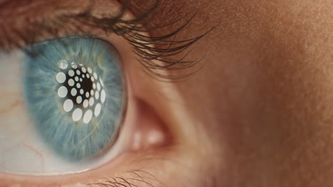 close-up-beautiful-blue-eye-opening-blinking-with-light-reflecting-on-iris-macro-healthy-eyesight-surgery-concept