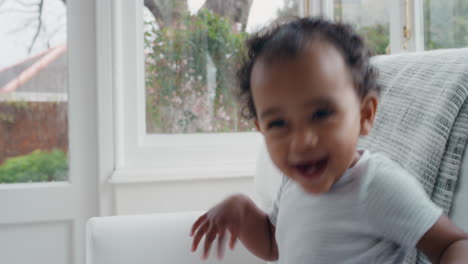 happy-baby-playfully-jumping-on-sofa-cute-toddler-dancing-having-fun-enjoying-carefree-childhood-4k