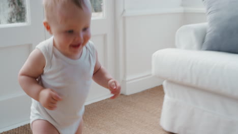 happy-baby-boy-toddler-learning-to-walk-exploring-home-having-fun-curious-infant-walking-through-house-enjoying-childhood-4k-footage