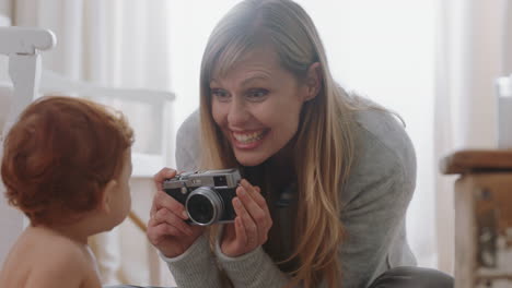 happy-mother-taking-photo-of-baby-using-camera-excited-mom-photographing-cute-toddler-enjoying-motherhood-lifestyle-making-memories