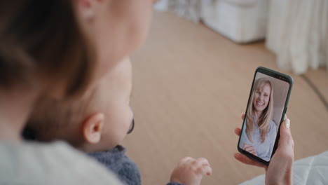 mother-and-baby-using-smartphone-having-video-chat-with-best-friend-waving-at-toddler-happy-mom-enjoying-sharing-motherhood-lifestyle-on-mobile-phone-screen-4k