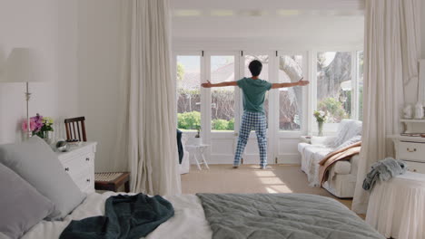 funny-young-man-dancing-in-bedroom-having-fun-celebrating-feeling-positive-enjoying-successful-lifestyle-doing-silly-dance-at-home-on-weekend-morning-wearing-pajamas