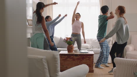 happy-multiracial-family-dancing-at-home-having-fun-enjoying-dance-celebrating-exciting-weekend-together-wearing-pajamas