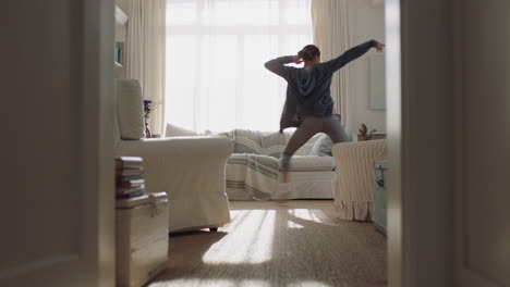 happy-young-woman-dancing-at-home-having-fun-celebrating-with-funny-dance-moves-enjoying-freedom-on-weekend-morning-4k-footage