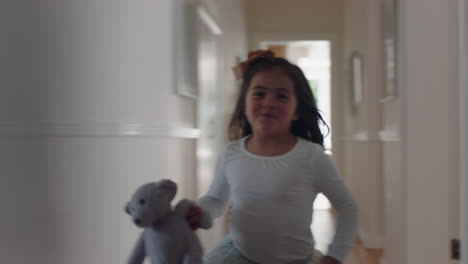 beautiful-little-girl-runningthrough-house-jumping-on-bed-holding-teddy-bear-having-fun-child-in-playful-mood-enjoying-weekend-morning-at-home