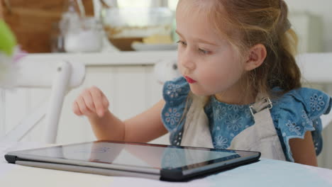 happy-child-using-tablet-computer-little-girl-drawing-pictures-on-touchscreen-device-enjoying-childhood-creativity-playing-games-on-mobile-device-at-home-4k